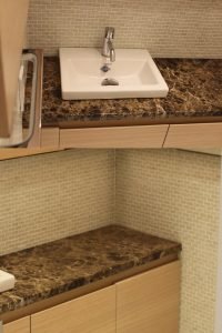 When surrounded with the right material, even the smallest of sinks makes a grand statement.