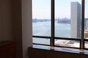 Custom milled wood flooring was installed in this project and butts up to Trespa-clad radiator covers. These details send your eye wandering to the fabulous view.