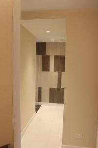 The simple addition of a second tile color mixed with random shapes transforms an ordinary wall into an ocular experience.