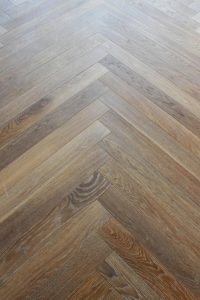 The Chevron pattern utilized in this room accentuates the degree of detail in which the client selected finishes throughout the home.