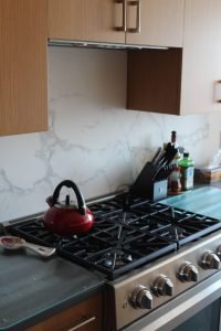 The kettle is always ready for a cup of tea in this inviting kitchen.