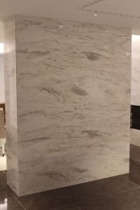 A stone-wrapped column is one of the many eye-catching details created for this home.