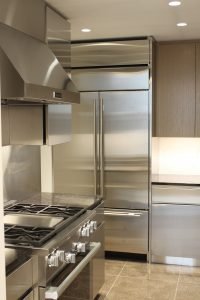 Stainless steel cabinets add heft to this professional-grade kitchen.