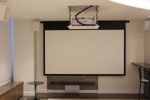 If there is ever a time that the inhabitants of this home tire of marveling at the gorgeous finishes, they can simply push a button and lose themselves in a movie from the custom home entertainment system concealed in the ceiling.
