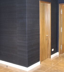 The halls of this home were wrapped with a paper so special that it is rivaled only by the doors into which it runs.