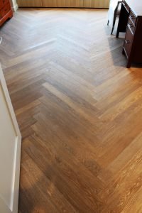 The Chevron pattern utilized in this room accentuates the degree of detail in which the client selected finishes throughout the home.